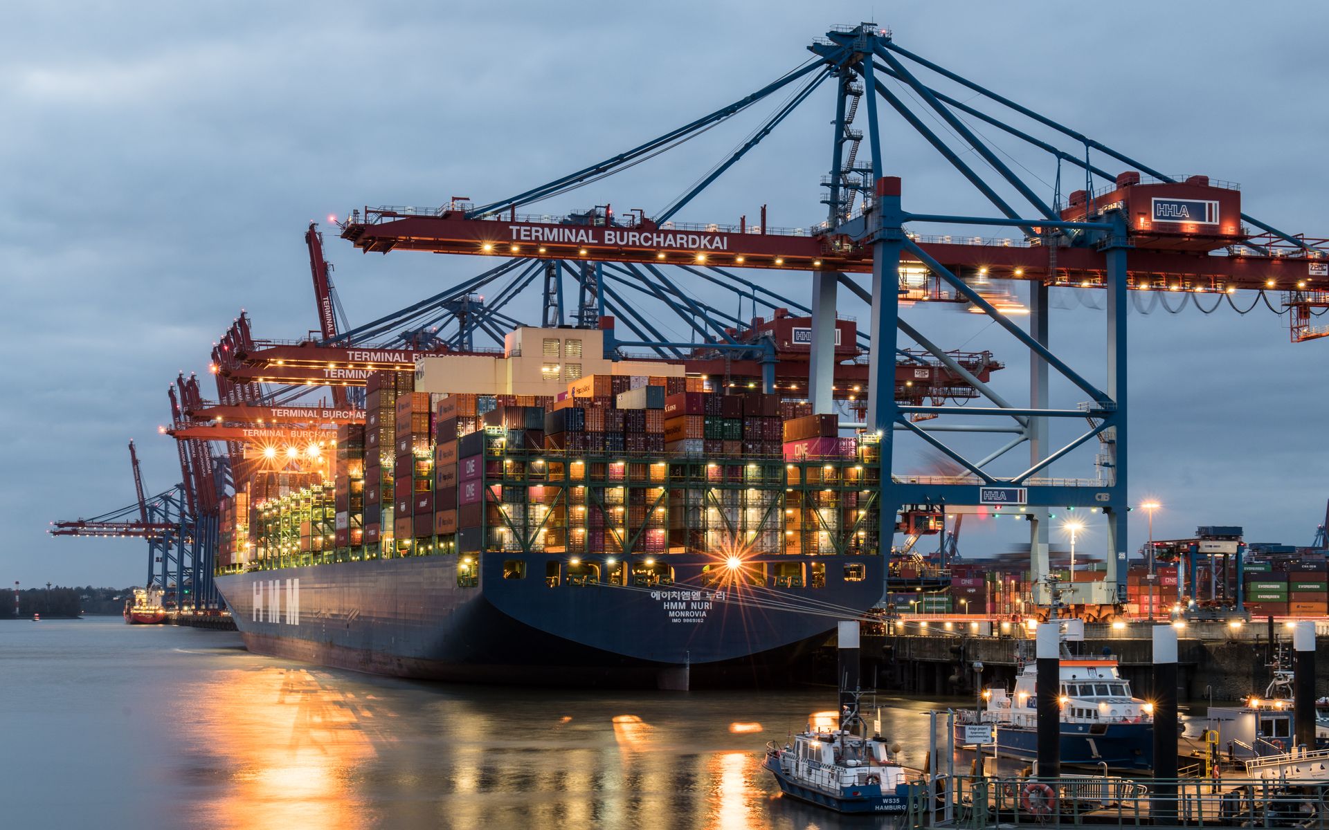 Container terminal at blue hour with gantry cranes